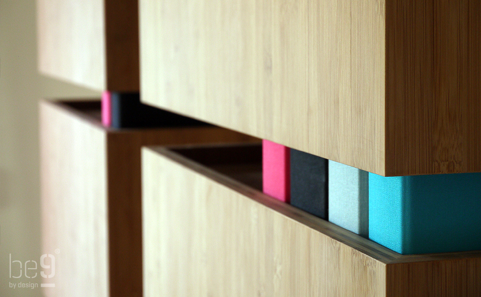 Close-up of folders in bamboo bookcases